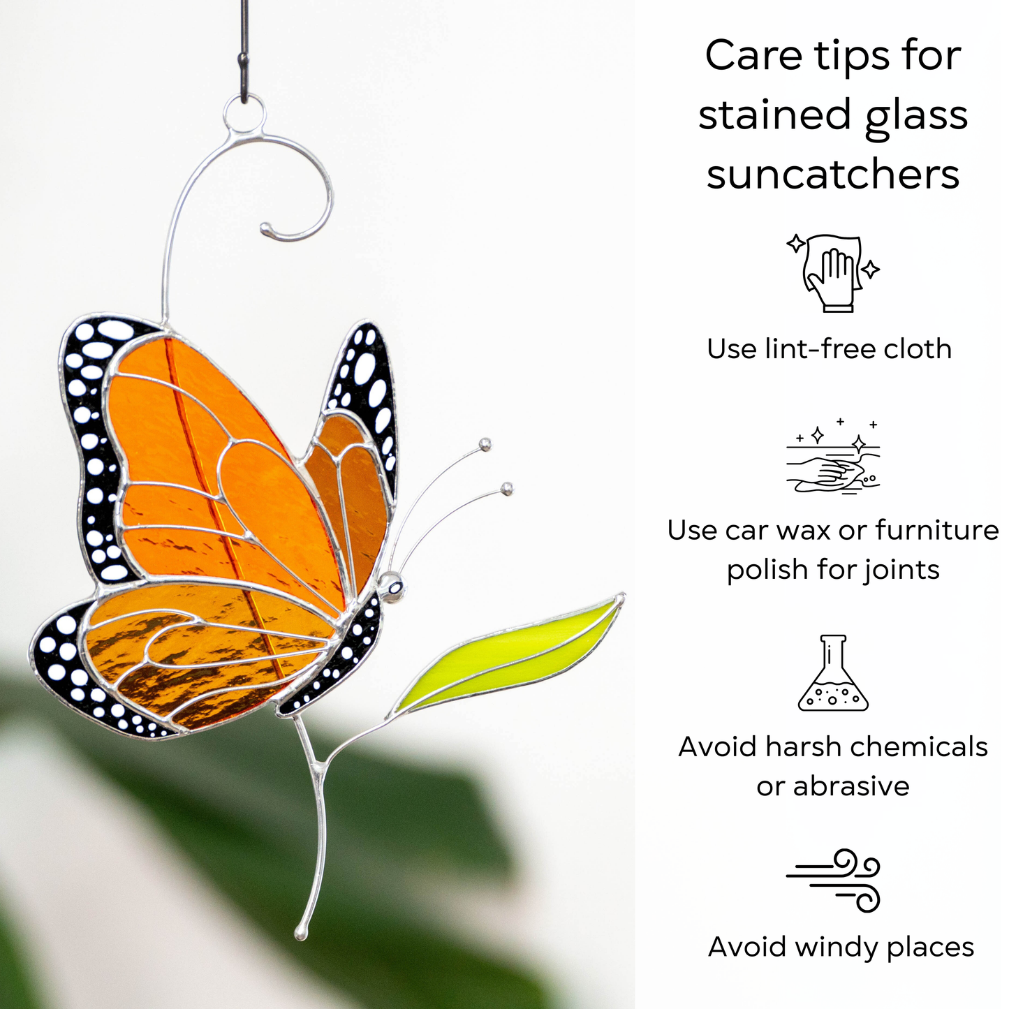Brightly colored side view stained glass monarch butterfly with care instructions displayed: use lint-free cloth, polish joints with car wax or furniture polish, avoid harsh chemicals, and windy places.