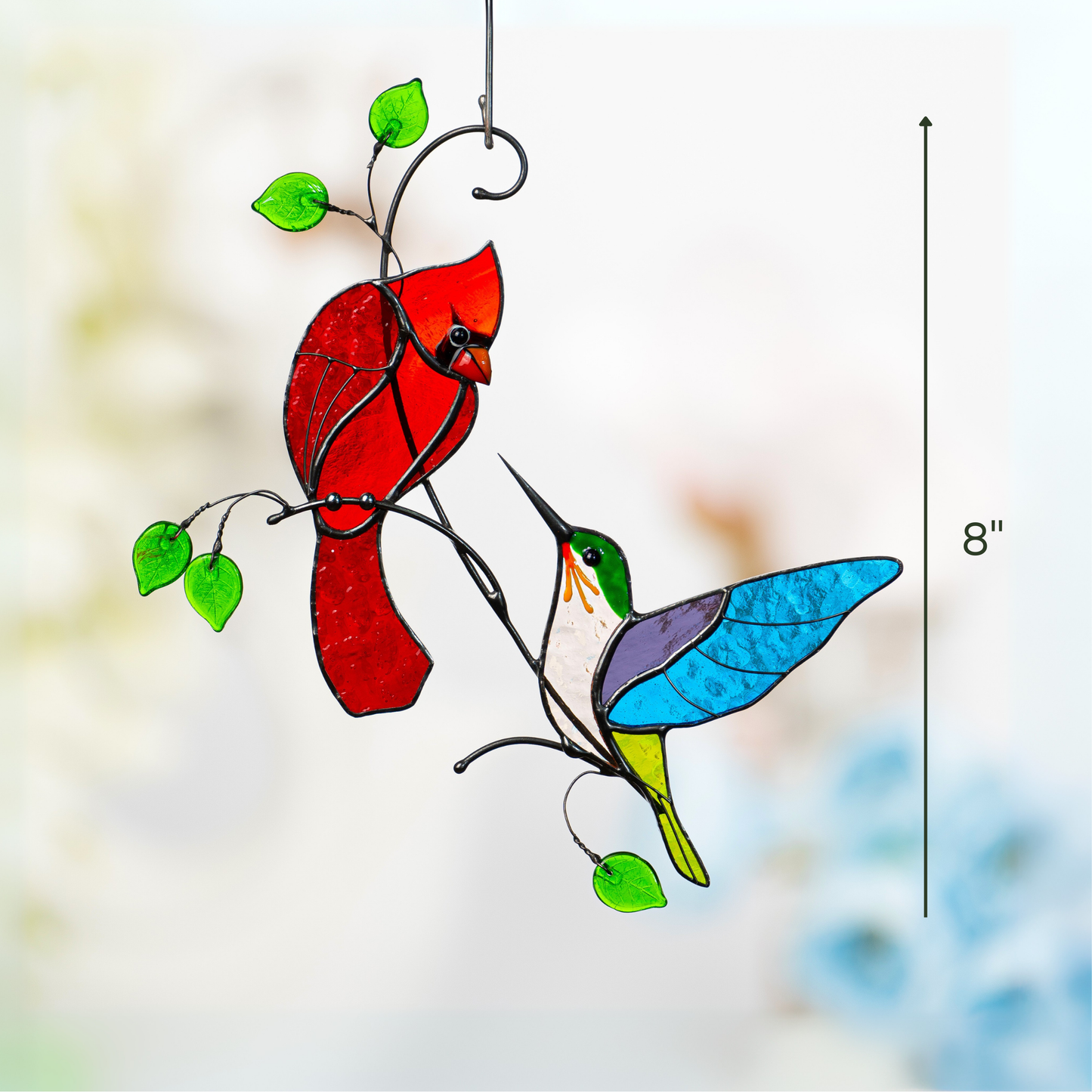 Close-up of colorful stained glass suncatcher featuring cardinal and hummingbird with size marked 8 inches.