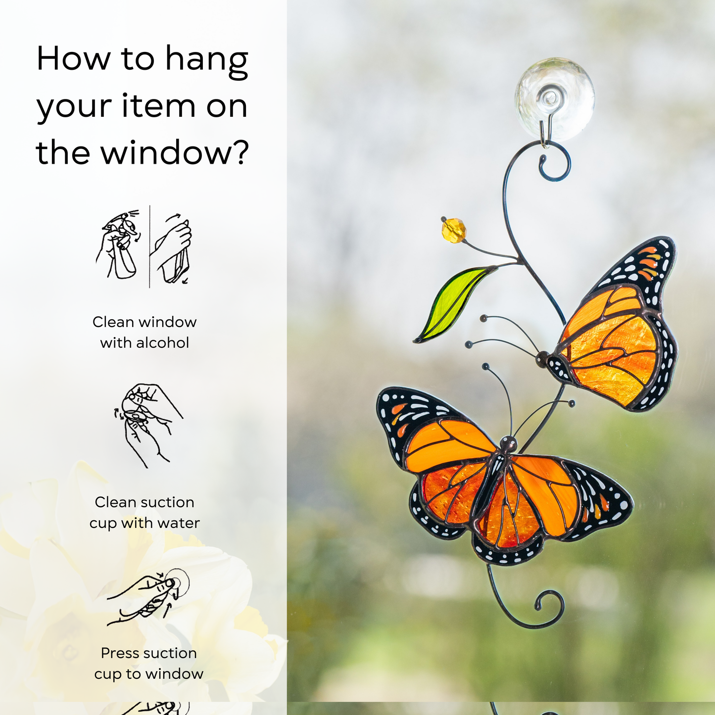 Monarch stained glass suncatcher attached to a window, with sunlight highlighting the vibrant orange wings, instruction beside: clean window and suction cup, press a cup to the surface.