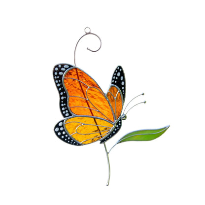 Stained glass butterfly ornament on a white background