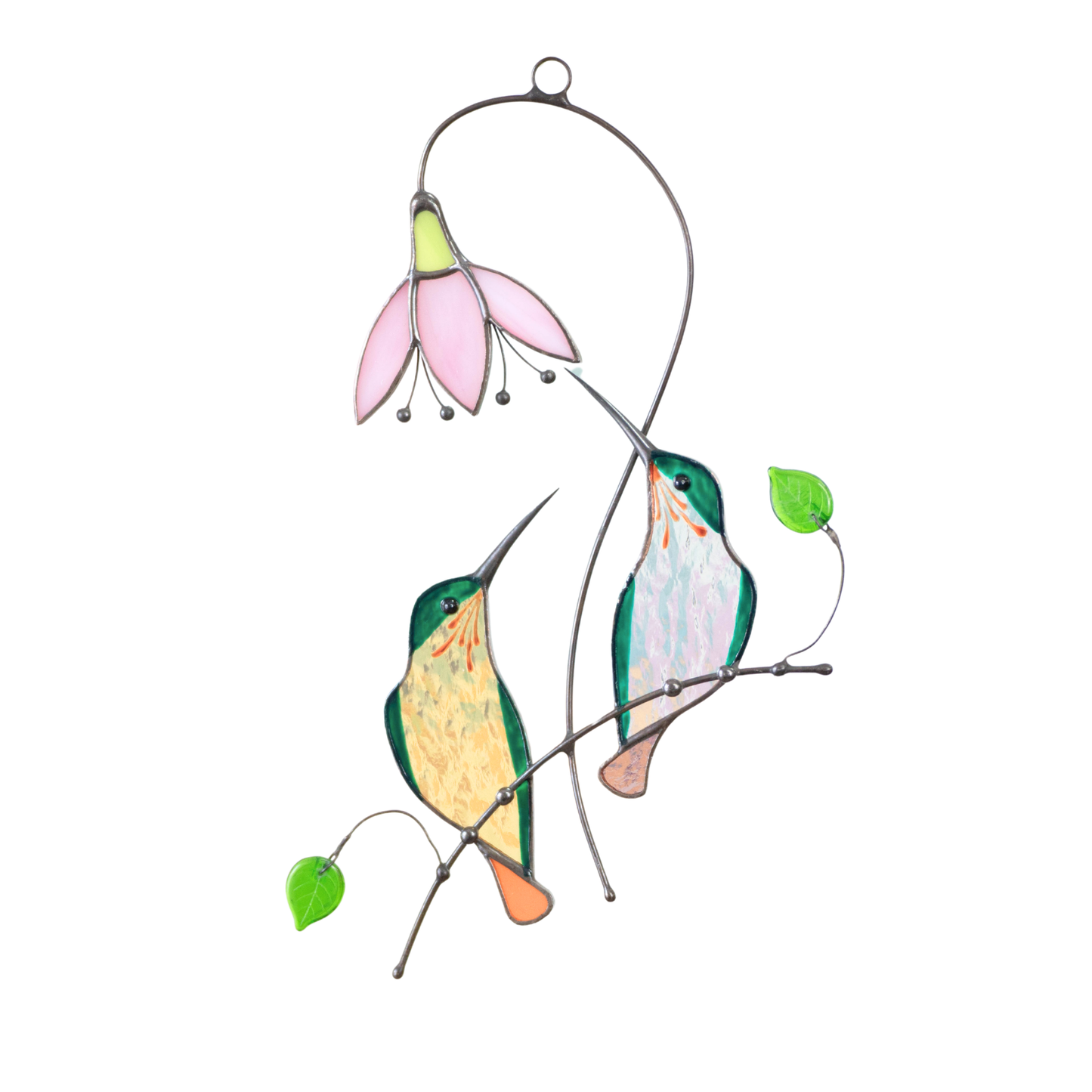 Stained glass couple of green hummingbirds sitting on the branch with pink flower.