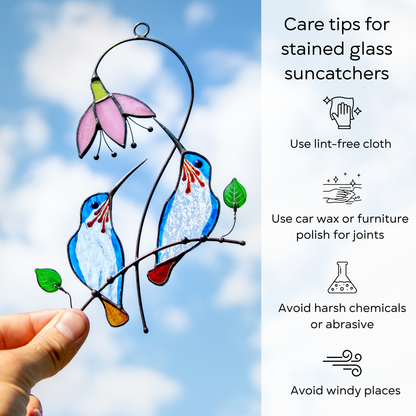 Pair of stained glass hummingbirds with care tips beside: use lint-free cloth, polish joints with car wax or furniture polish, avoid harsh chemicals, and windy places.