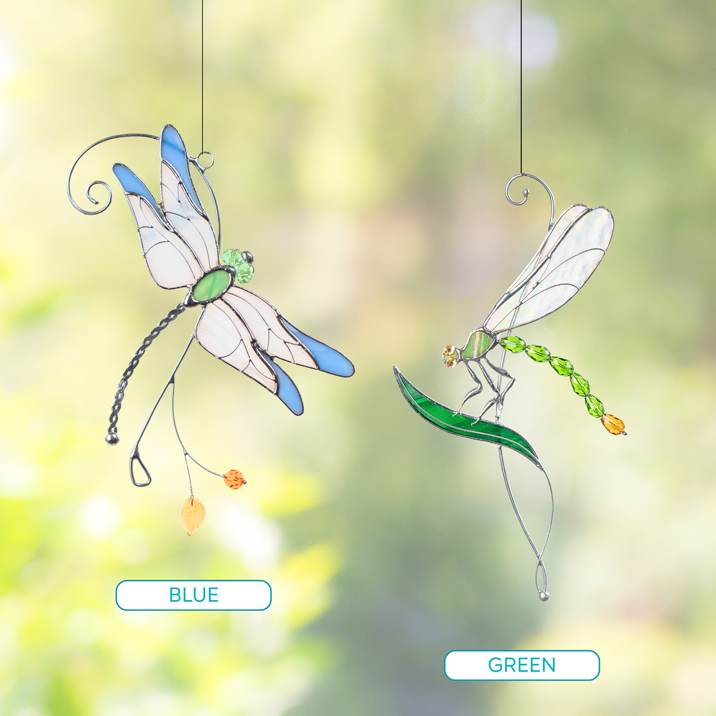 Pair_of_stained_glass_dragonflies_suncatchers_in_green_and_blue_color_options_shown_in_outdoor_setting