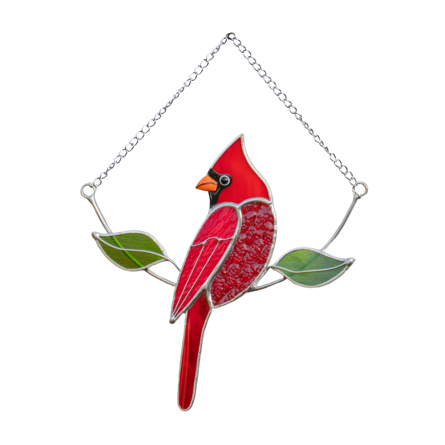 Handmade stained glass suncatcher featuring male cardinal sitting on the branch 
