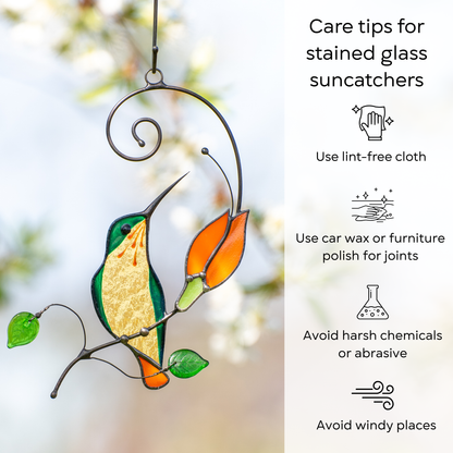 Stained glass hummingbird suncatcher hanging in the garden with care tips beside: use lint-free cloth, polish joints with car wax or furniture polish, avoid harsh chemicals, and windy places.