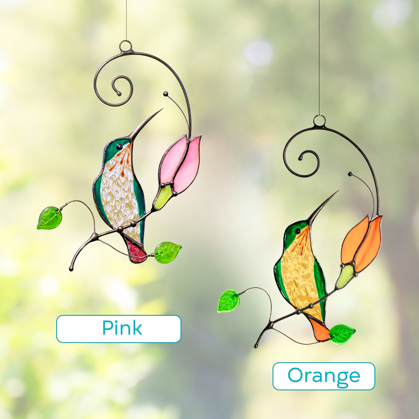 Two stained glass hummingbirds with orange and pink flowers hanging.