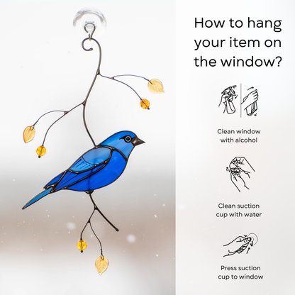 Hanging guide for indigo bunting stained glass suncatcher, including cleaning and pressing steps with suction cup.