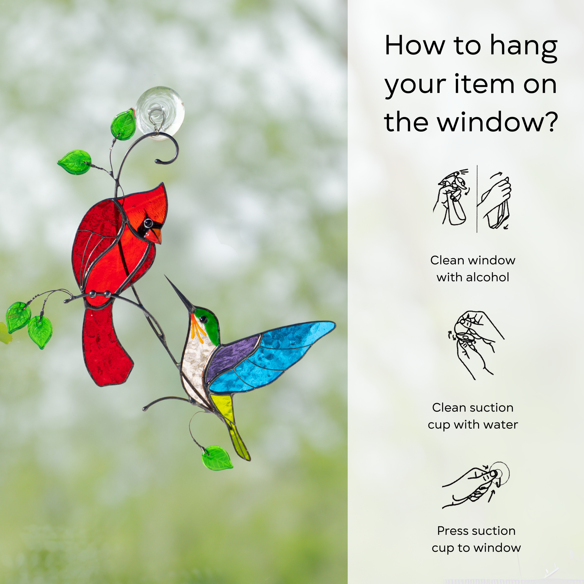 Cardinal and hummingbird stained glass suncatcher attached to window using suction cup.