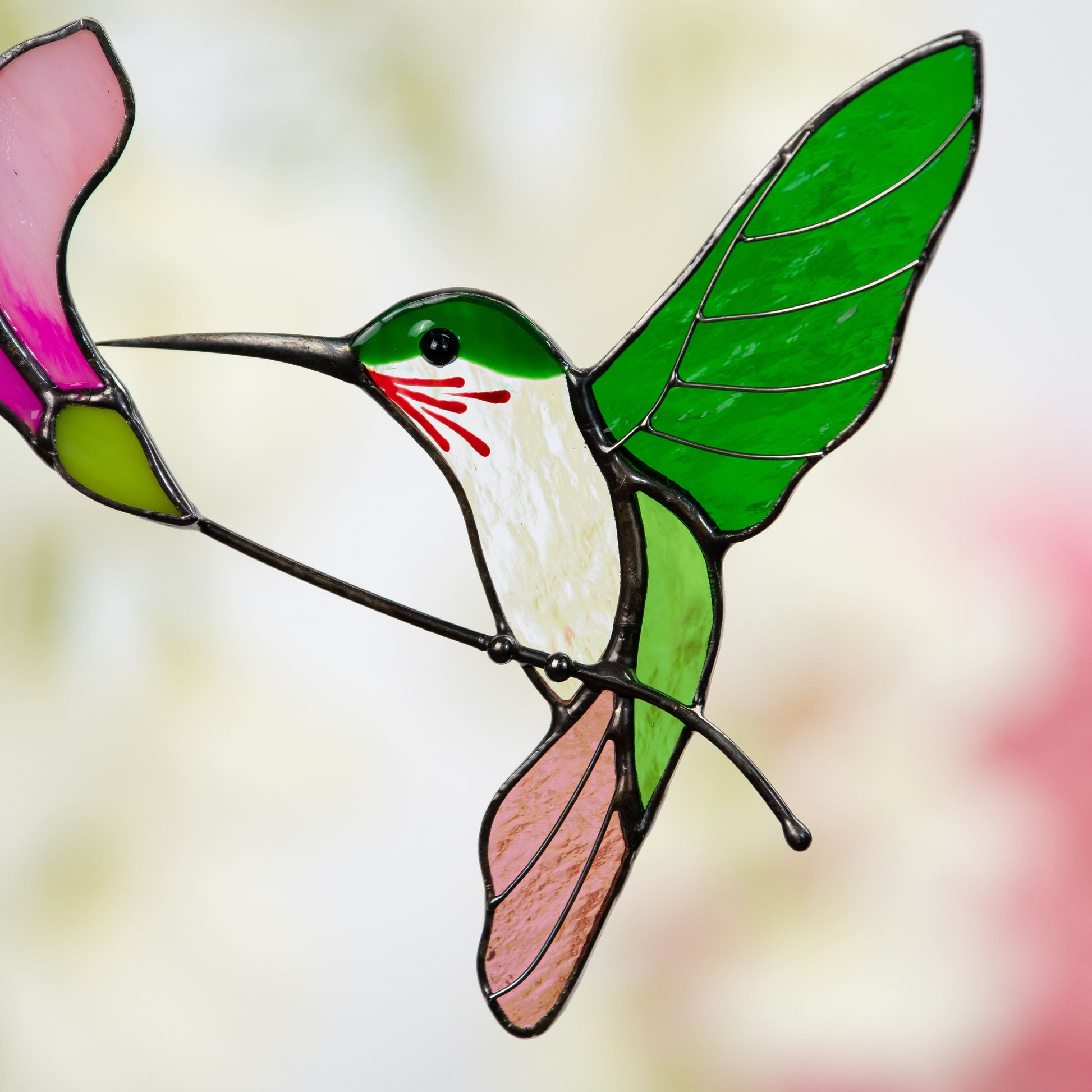 Zoomed stained glass flying hummingbird 
